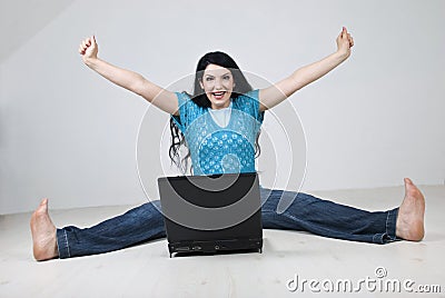 Excited woman using laptop Stock Photo