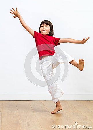 Excited young child fainting to fall in practicing martial arts Stock Photo