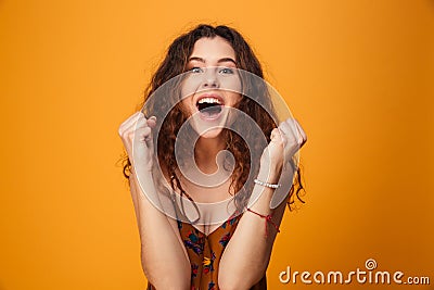 Excited young lady make winner gesture. Stock Photo