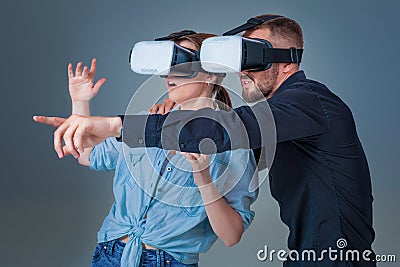Excited young man and woman having fun with a VR glasses Stock Photo