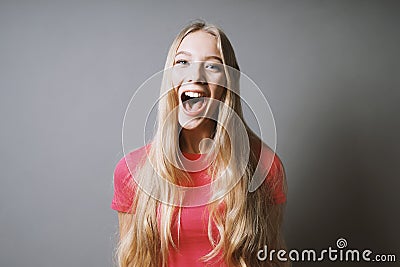 Excited young woman whoop of joy or shout of delight Stock Photo