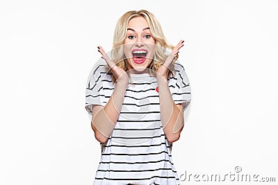 Excitement and amazement. Attractive young woman screaming with joy, with eyes full of happiness, excited. Stock Photo