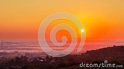 Exciting sunrise over fogged city and park, aerial view, Lviv Stock Photo