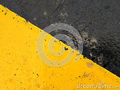 Exciting yellow and black graphic texture painted on rough surface. Stock Photo