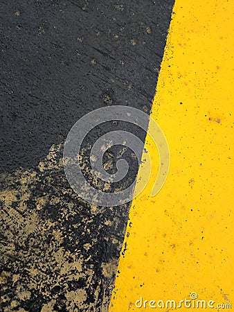 Exciting yellow and black graphic texture painted on rough surface. Stock Photo