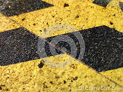 Exciting yellow and black graphic texture painted on rough surface. Stock Photo