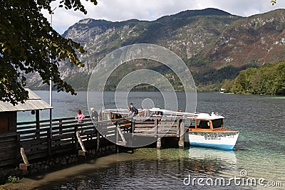 Excursion boat in nature scenery, Lake Bohinjsko jezero, Bohinj, Slovenia Editorial Stock Photo