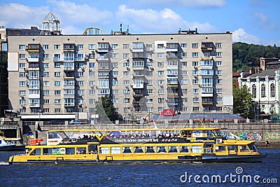 The excursion boat with passengers is sailing over the Dnieper river Editorial Stock Photo