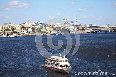 Excursion boat with passengers is sailing over the river Editorial Stock Photo