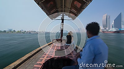 Trip on traditional Abra boat at the creek in Dubai, UAE timelapse Editorial Stock Photo