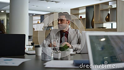 Executive man talking presentation on diverse business conference in office. Stock Photo