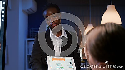 Executive manager black woman working in office meeting room explaining company management statistics Stock Photo