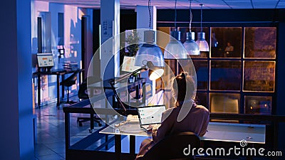 Executive manager creating business report at night Stock Photo