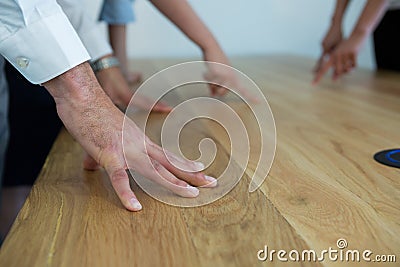 Executive standing with there hands on table during meeting Stock Photo