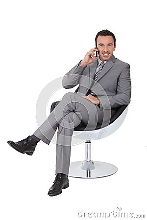 Executive in a swivel chair Stock Photo