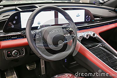 EXEED RX steering wheel and dashboard. Beige leather car interior. Vehicle interior SUV car. Modern car interior. Editorial Stock Photo