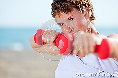 Exercise with dumbell Stock Photo