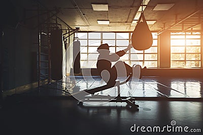 Exercise men endurance strength training in the gym. Silhouette shot in front of the window Stock Photo