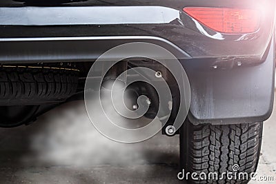 Exhaust from black car , air pollution concept Stock Photo