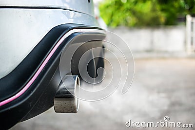 Exhaust from car,Smoke from a car producing pollution Stock Photo