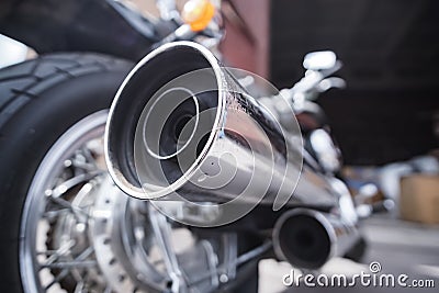 Exhaust chrome pipe of an old touring motorcycle in close-up Stock Photo