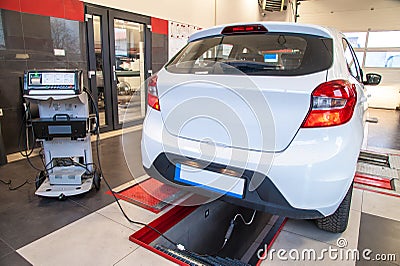 Exhaust gas measurement at a diagnostic station in a passenger car Stock Photo