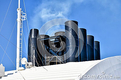Exhaust gases flow from the funnel of a cruise ship Stock Photo