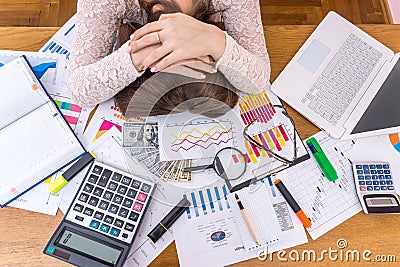Exhausted business analyst sleeps on her workplace Stock Photo