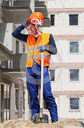 Exhausted construction worker Stock Photo