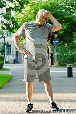 Exhausted elderly man after his jogging workout Stock Photo