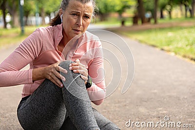 Exhausted jogger woman in the park Stock Photo