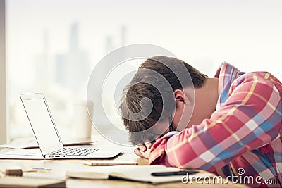 Exhausted male in office Stock Photo