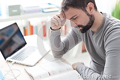 Exhausted man with headache Stock Photo