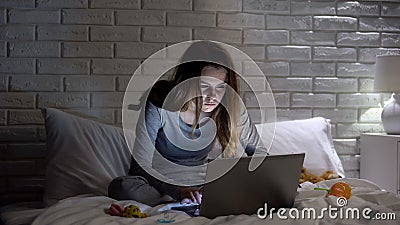 Exhausted mother searching tips for young parents in internet, falling asleep Stock Photo