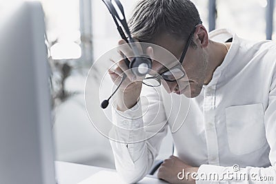 Exhausted office worker taking a break Stock Photo