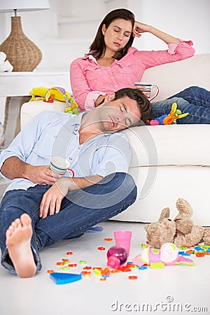 Exhausted parents resting Stock Photo