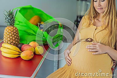 Exhausted but resilient, a pregnant woman feels fatigue after bringing home a sizable bag of groceries, showcasing her Stock Photo