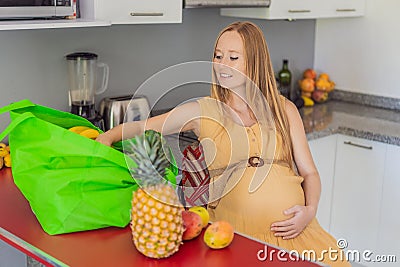 Exhausted but resilient, a pregnant woman feels fatigue after bringing home a sizable bag of groceries, showcasing her Stock Photo