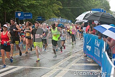 Exhausted Runners Approach Finish Line At Atlanta Peachtree Road Race Editorial Stock Photo