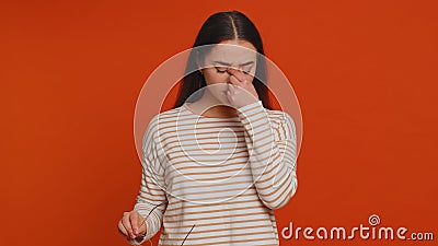 Exhausted tired woman takes off glasses, feels eyes pain, being overwork burnout working, headache Stock Photo