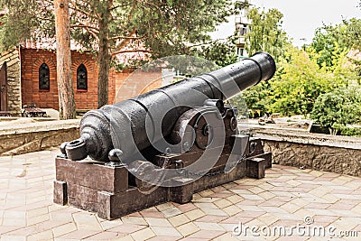 Exhibit military ancient cannon in the old city Editorial Stock Photo