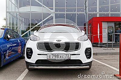 Exhibition car stands in front of the building of KIA MOTORS car selling and service center Editorial Stock Photo