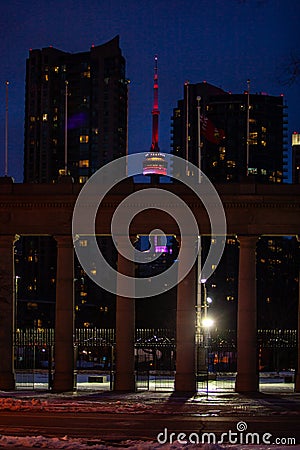 Exhibition district in modern metropolis city of Toronto, with epic night view of famous CN tower in background Editorial Stock Photo