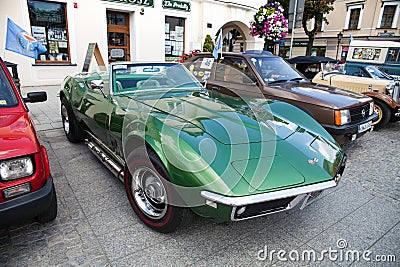 Exhibition of old cars. Interior of an old car. Old design in cars. Beautiful green old Corvette Convertible, side view. Oswiecim Editorial Stock Photo