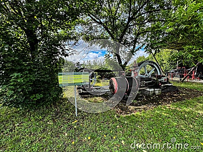 An exhibition of old steam engines on the square next to the historic stebra mine in Tarnowskie GÃ³ry. A steam engine driving a Editorial Stock Photo