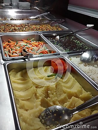 EXHIBITOR OF HOT MEALS TYPE BUFFET IN RESTAURANT AND HOTELS Stock Photo