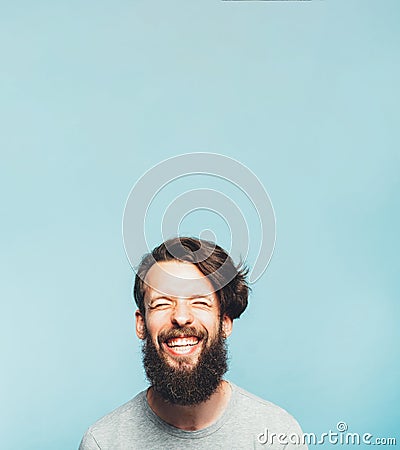 Exhilarated bearded hipster happy feeling emotion Stock Photo