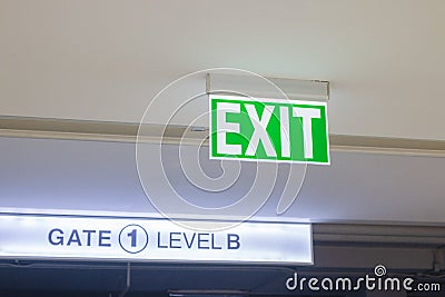 Exit doors with `Excit` hanging signs Stock Photo