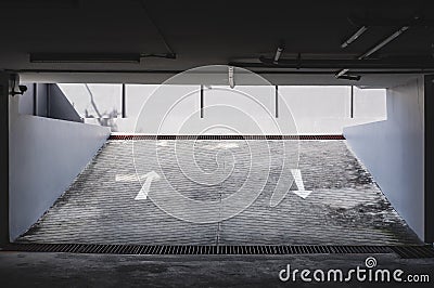 Exit entrance of underground car parking with arrows road sign Stock Photo