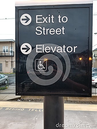 Exit sign to street and elevator Editorial Stock Photo